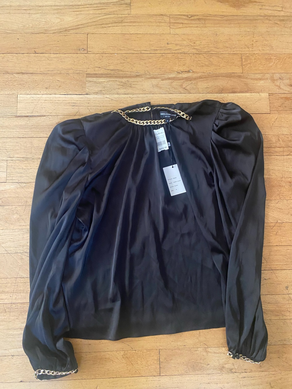 Generation Love great black top. Perry chain . Size medium. NWT